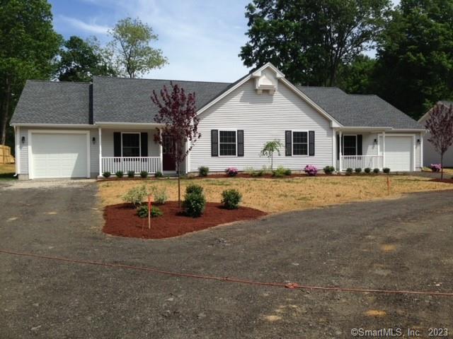 120 Ashford Road, Unit 1 Eastford, CT 06242 - Photo 1 of 1 a front view of house with yard and trees around