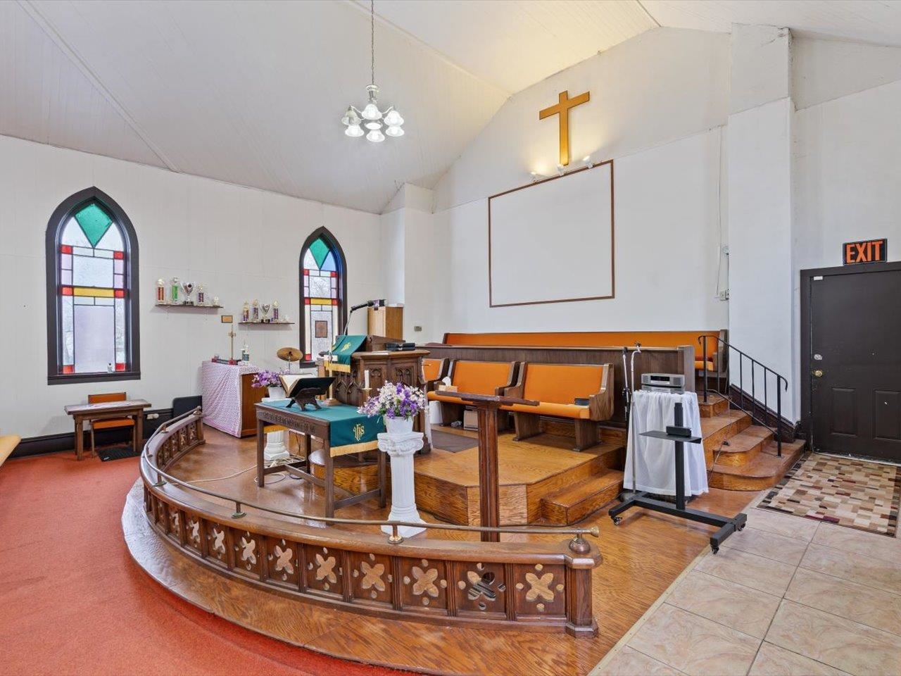 1222 7th Avenue Moline, IL 61265 - Photo 16 of 24 a living room with furniture and a chandelier