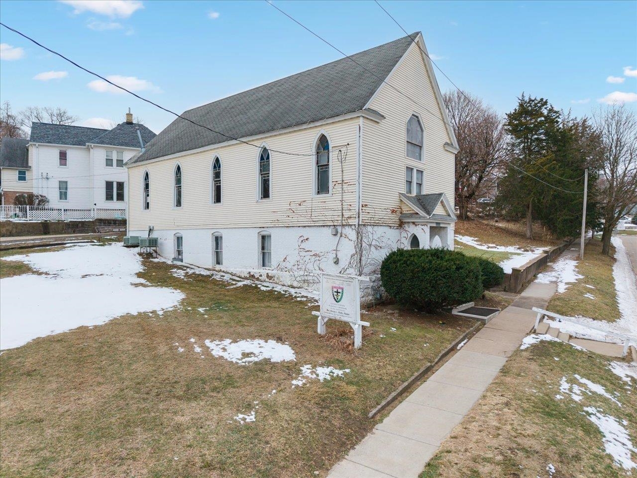 1222 7th Avenue Moline, IL 61265 - Photo 8 of 24 a view of a white house with a yard