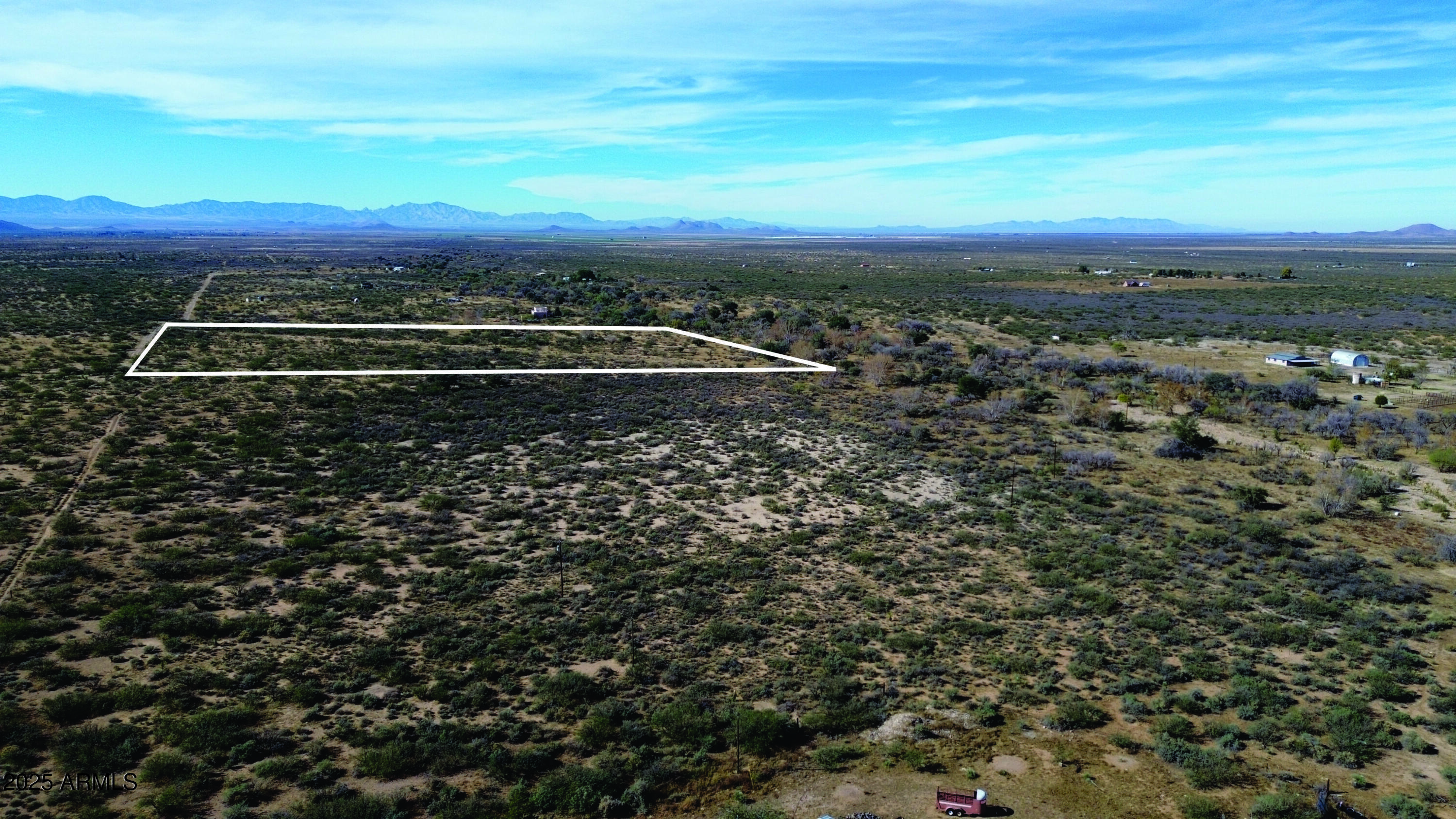 10-acres East Roadrunner Road Pearce, AZ 85625 - Photo 21 of 37 a view of a yard with wooden fence