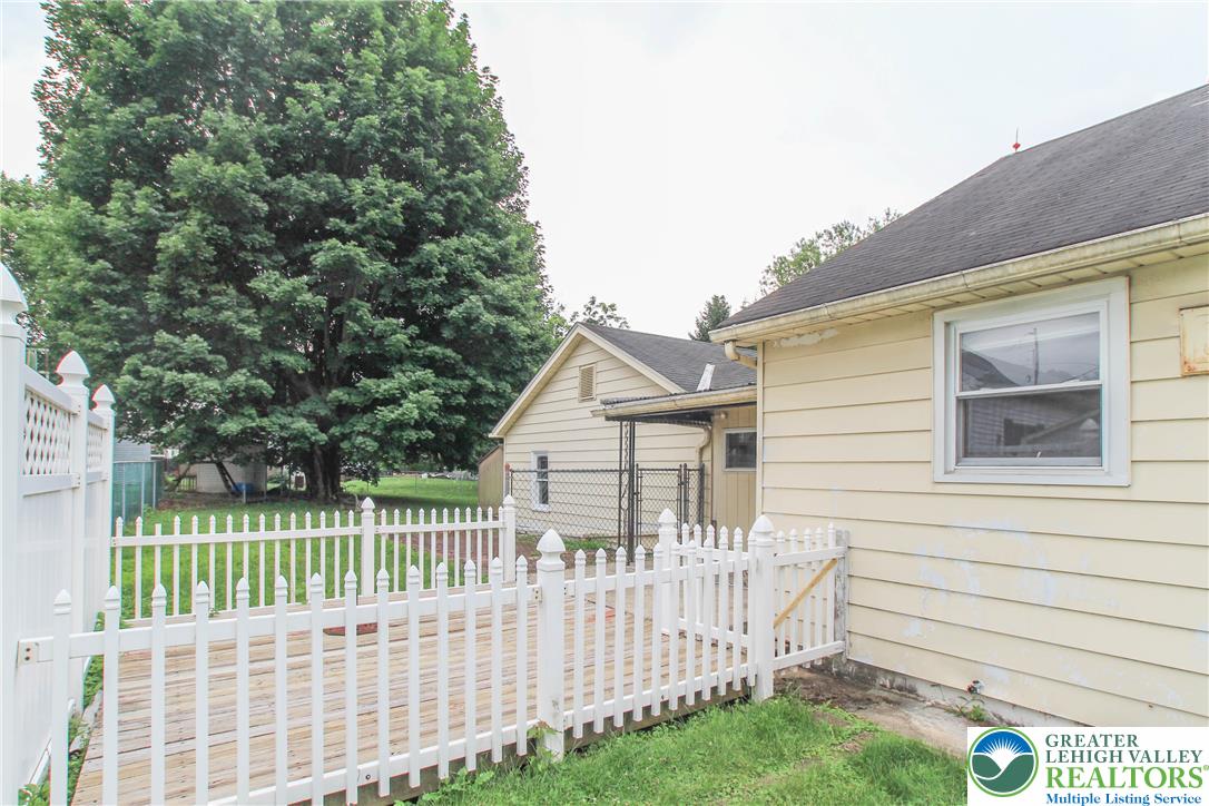 492 Filetown Road Nazareth, PA 18064 - Photo 5 of 30 A well-maintained wooden deck with a classic picket fence invites outdoor enjoyment.