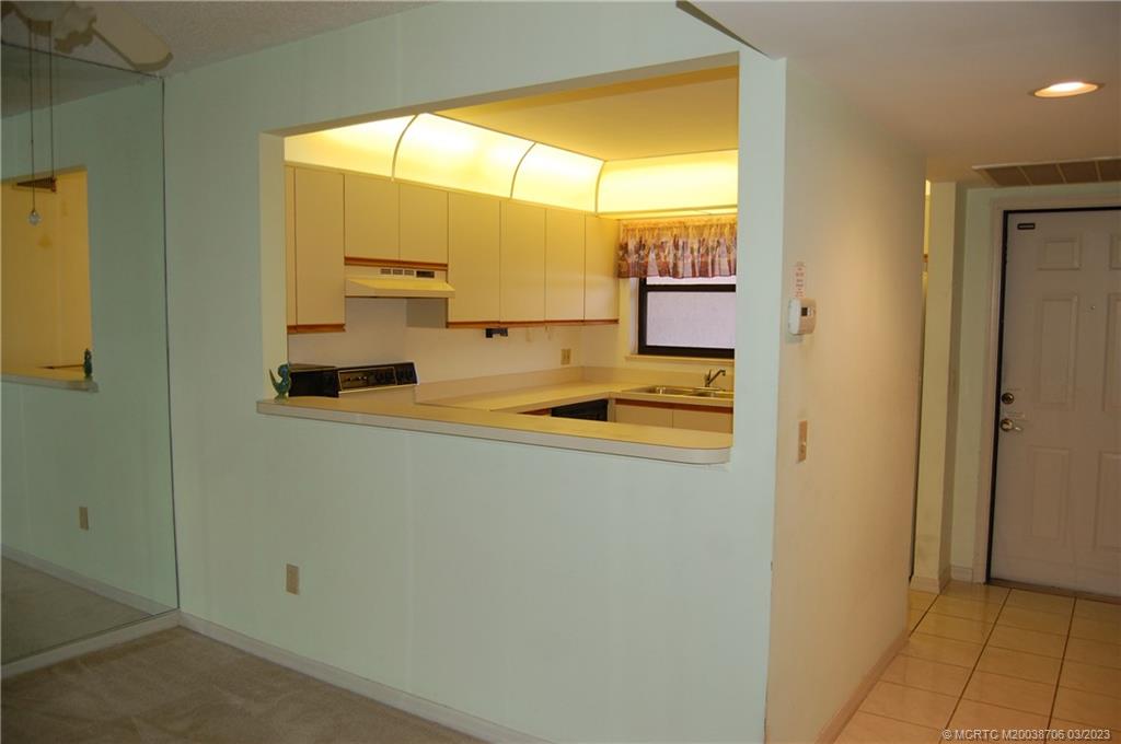 1881 Southwest Palm City Road, Unit H201 Stuart, FL 34994 - Photo 11 of 33 a bathroom with a sink and a mirror