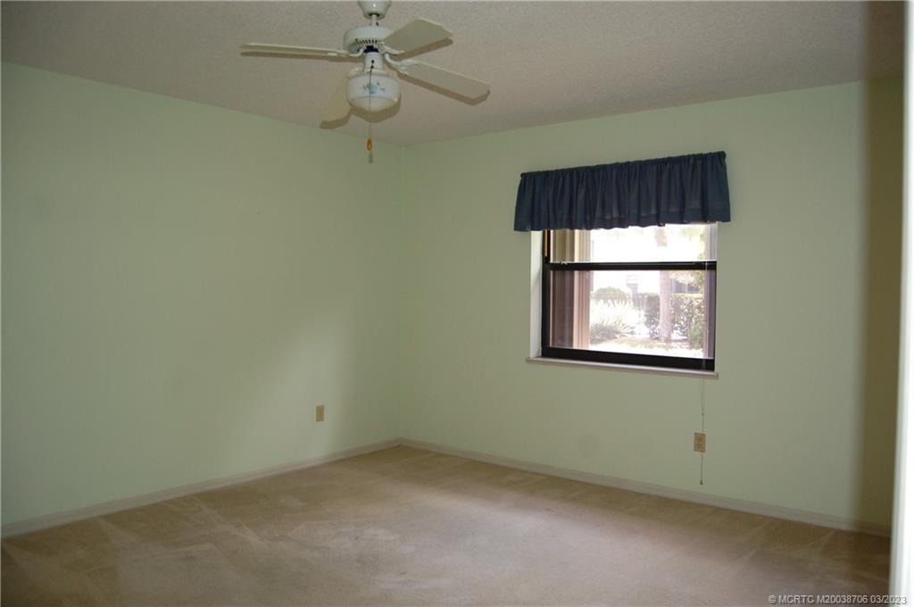 1881 Southwest Palm City Road, Unit H201 Stuart, FL 34994 - Photo 15 of 33 an empty room with a window