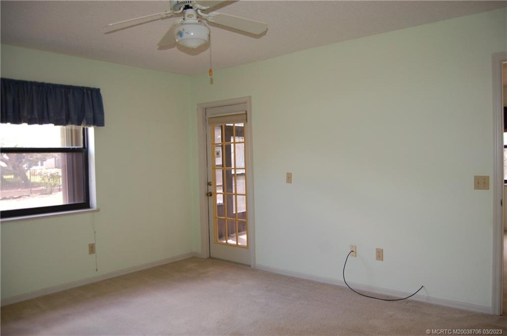 1881 Southwest Palm City Road, Unit H201 Stuart, FL 34994 - Photo 16 of 33 an empty room with windows and closet