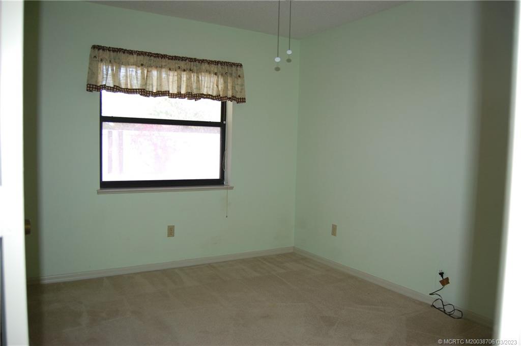1881 Southwest Palm City Road, Unit H201 Stuart, FL 34994 - Photo 20 of 33 an empty room with a window