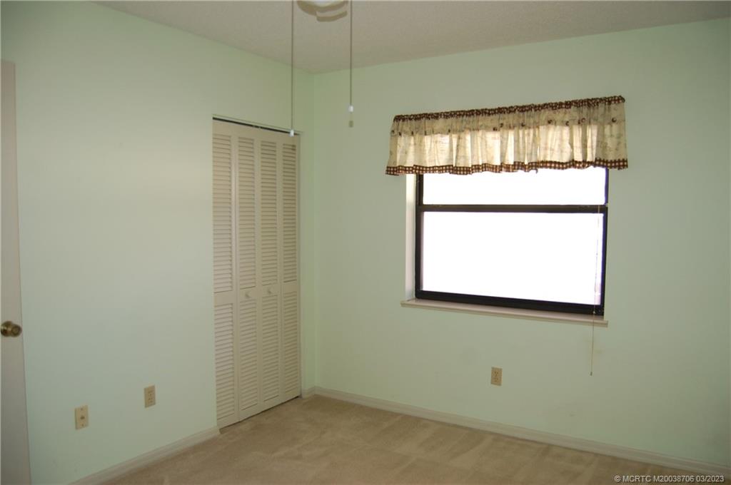 1881 Southwest Palm City Road, Unit H201 Stuart, FL 34994 - Photo 21 of 33 a view of a window in an empty room