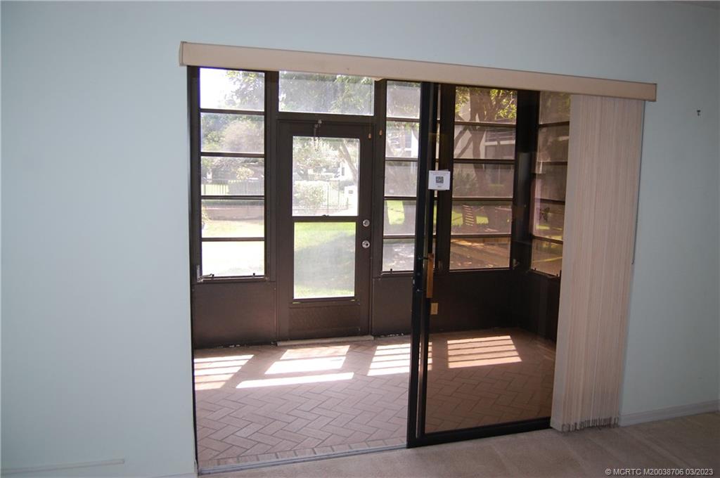 1881 Southwest Palm City Road, Unit H201 Stuart, FL 34994 - Photo 24 of 33 a view of an empty room and window