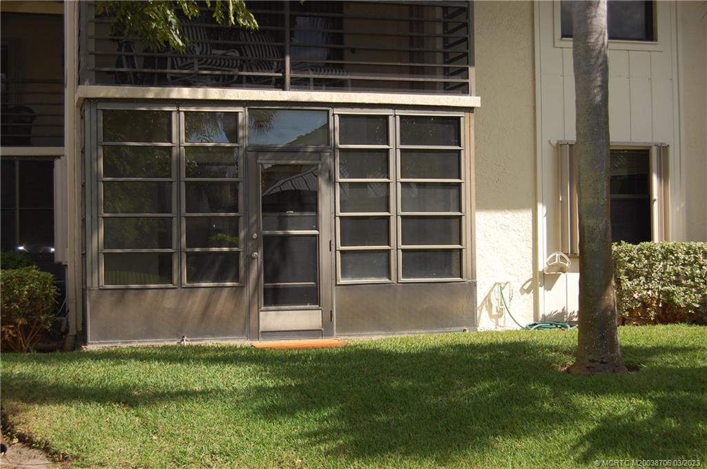 1881 Southwest Palm City Road, Unit H201 Stuart, FL 34994 - Photo 25 of 33 a view of house with backyard