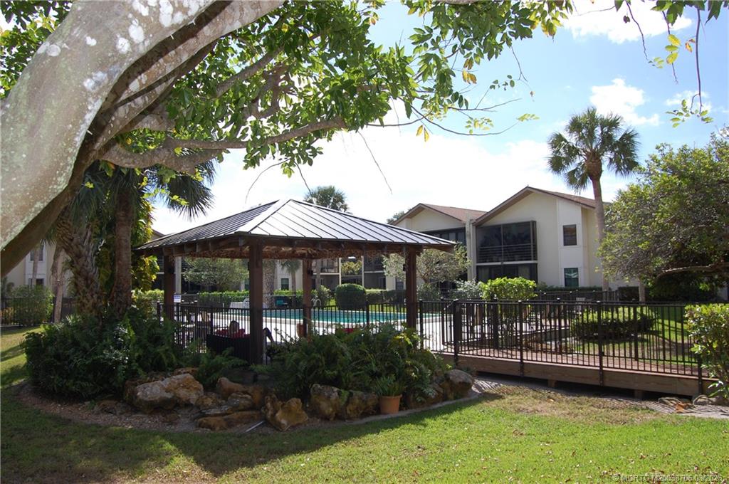 1881 Southwest Palm City Road, Unit H201 Stuart, FL 34994 - Photo 26 of 33 a front view of a house with garden