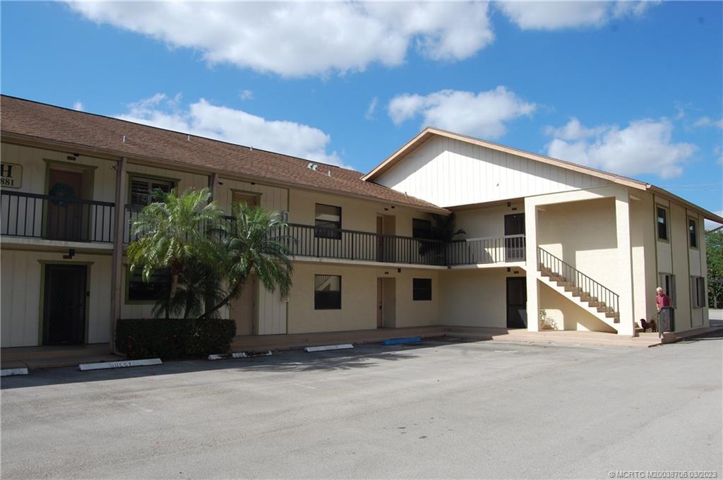 1881 Southwest Palm City Road, Unit H201 Stuart, FL 34994 - Photo 3 of 33 a view of a house with a street