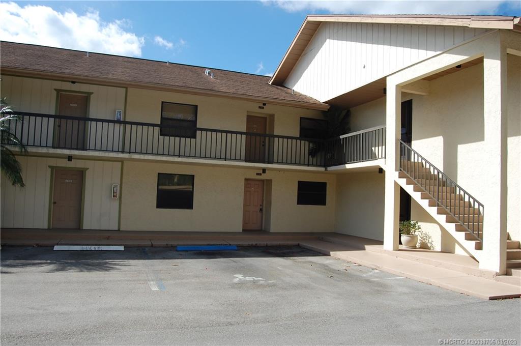 1881 Southwest Palm City Road, Unit H201 Stuart, FL 34994 - Photo 4 of 33 a view of a house with wooden fence