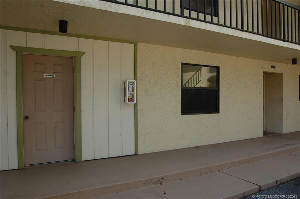 1881 Southwest Palm City Road, Unit H201 Stuart, FL 34994 - Photo 6 of 33 a view of a hallway to rooms