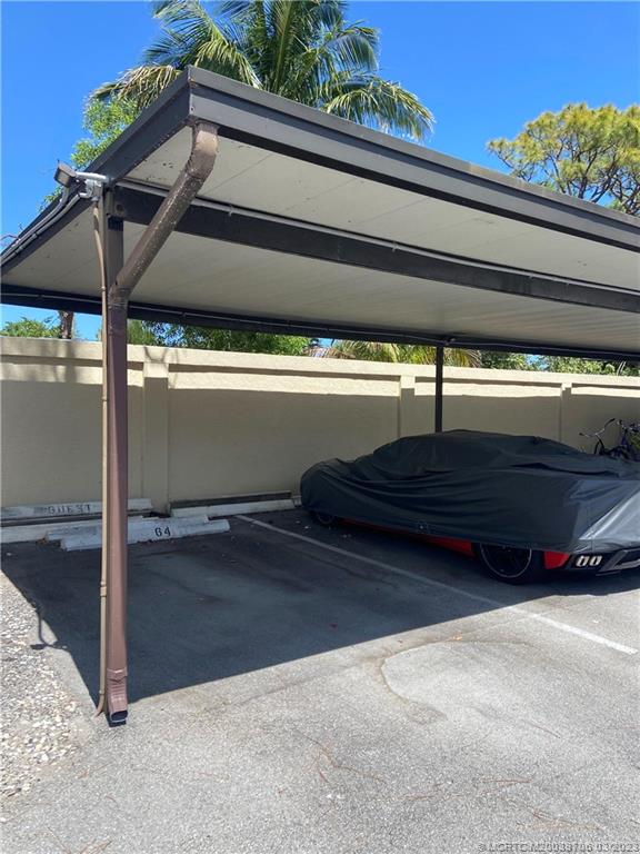 1881 Southwest Palm City Road, Unit H201 Stuart, FL 34994 - Photo 7 of 33 a view of backyard with wooden floor and a roof deck