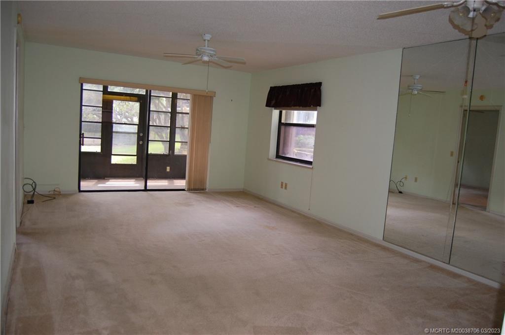 1881 Southwest Palm City Road, Unit H201 Stuart, FL 34994 - Photo 8 of 33 an empty room with windows and closet