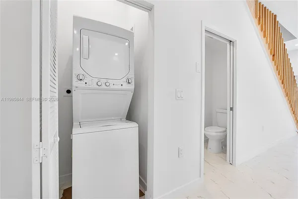 a view of a bathroom with a toilet and a sink