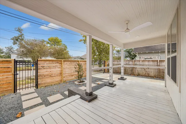 a view of a hall with wooden floor and windows