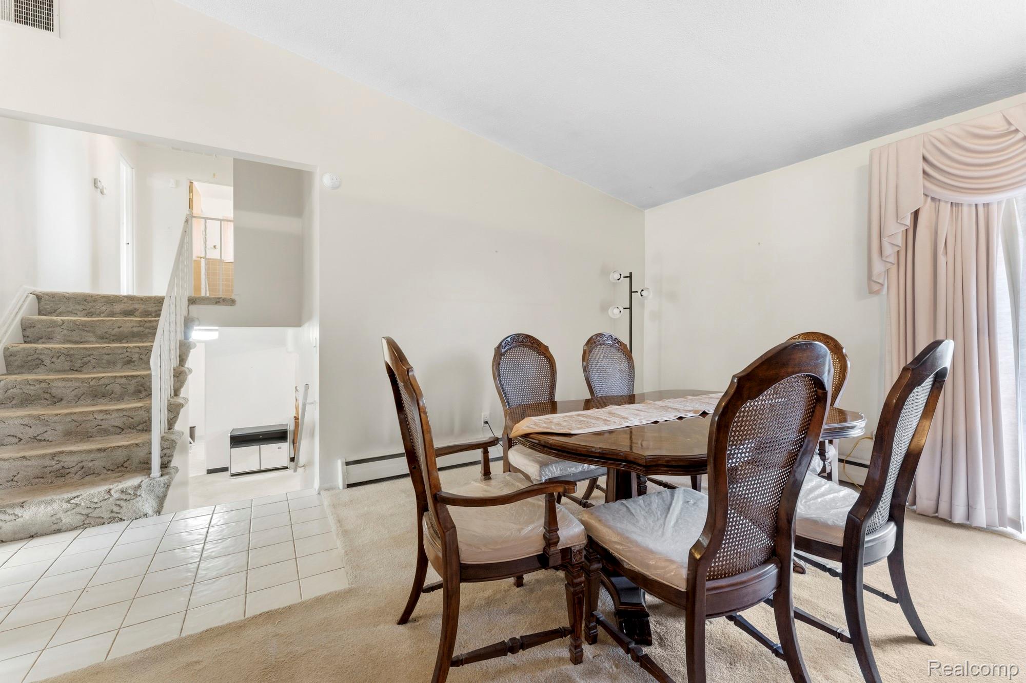23410 Joy Road Redford, MI 48239 - Photo 7 of 25 Dining area with light tile patterned floors and lofted ceiling