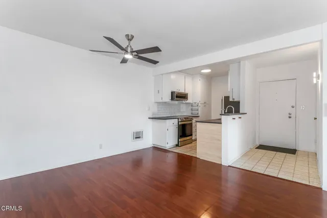 a view of kitchen with wooden floor and window