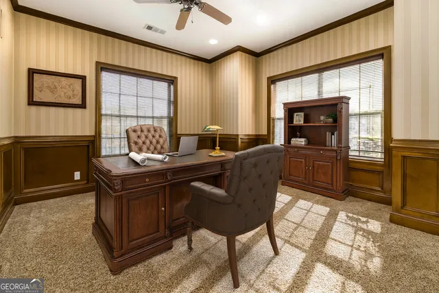 a view of a workspace with furniture