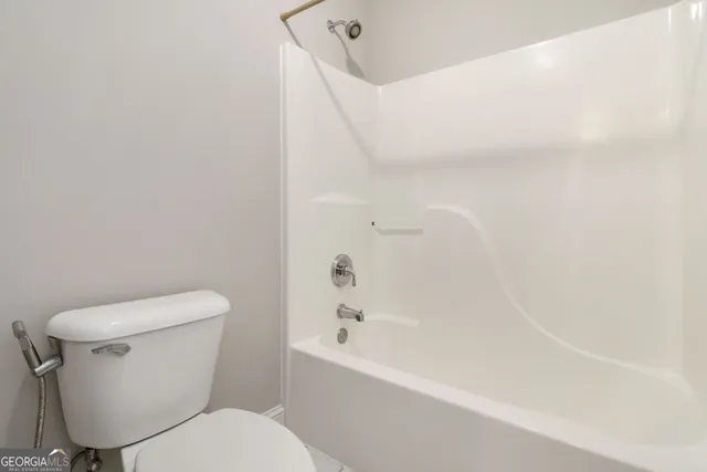 a kitchen with a sink and a wooden floor