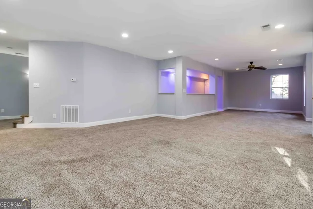 a white toilet sitting next to a bathroom sink