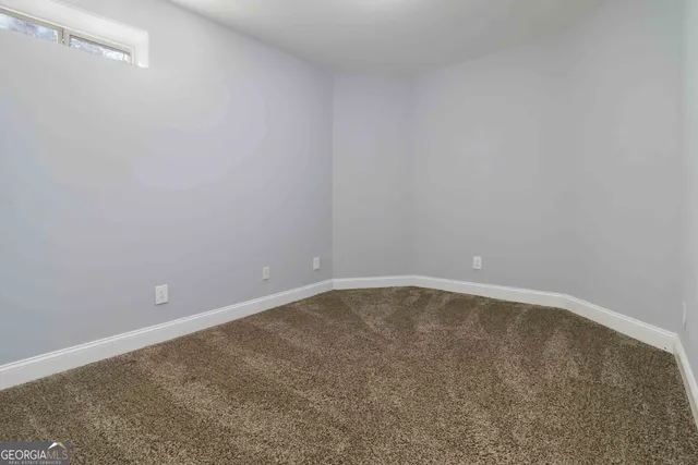 a view of empty room with windows