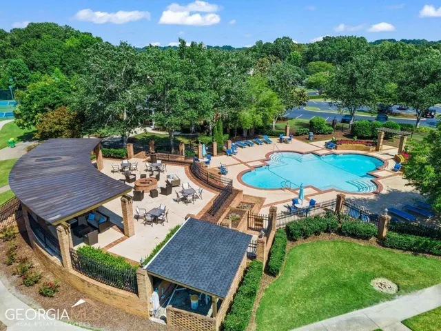 an aerial view of a house with outdoor space