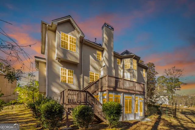 an aerial view of multiple houses with yard