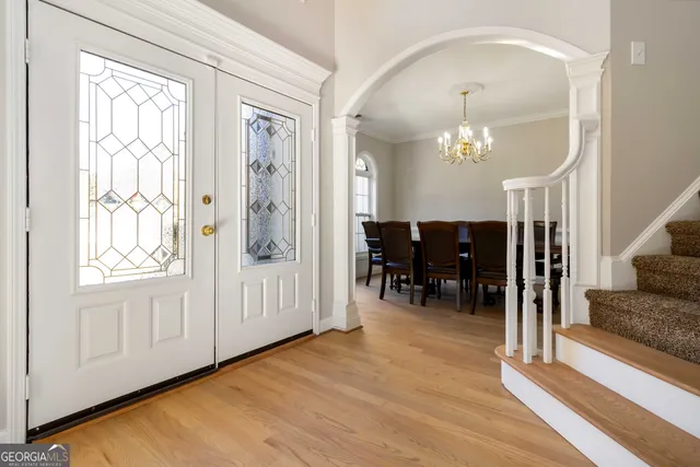 a view of livingroom with furniture and chandelier fan