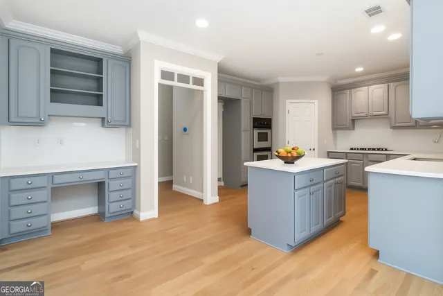 a kitchen with stainless steel appliances granite countertop a stove and a sink