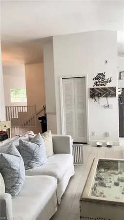 a living room with furniture and a rug