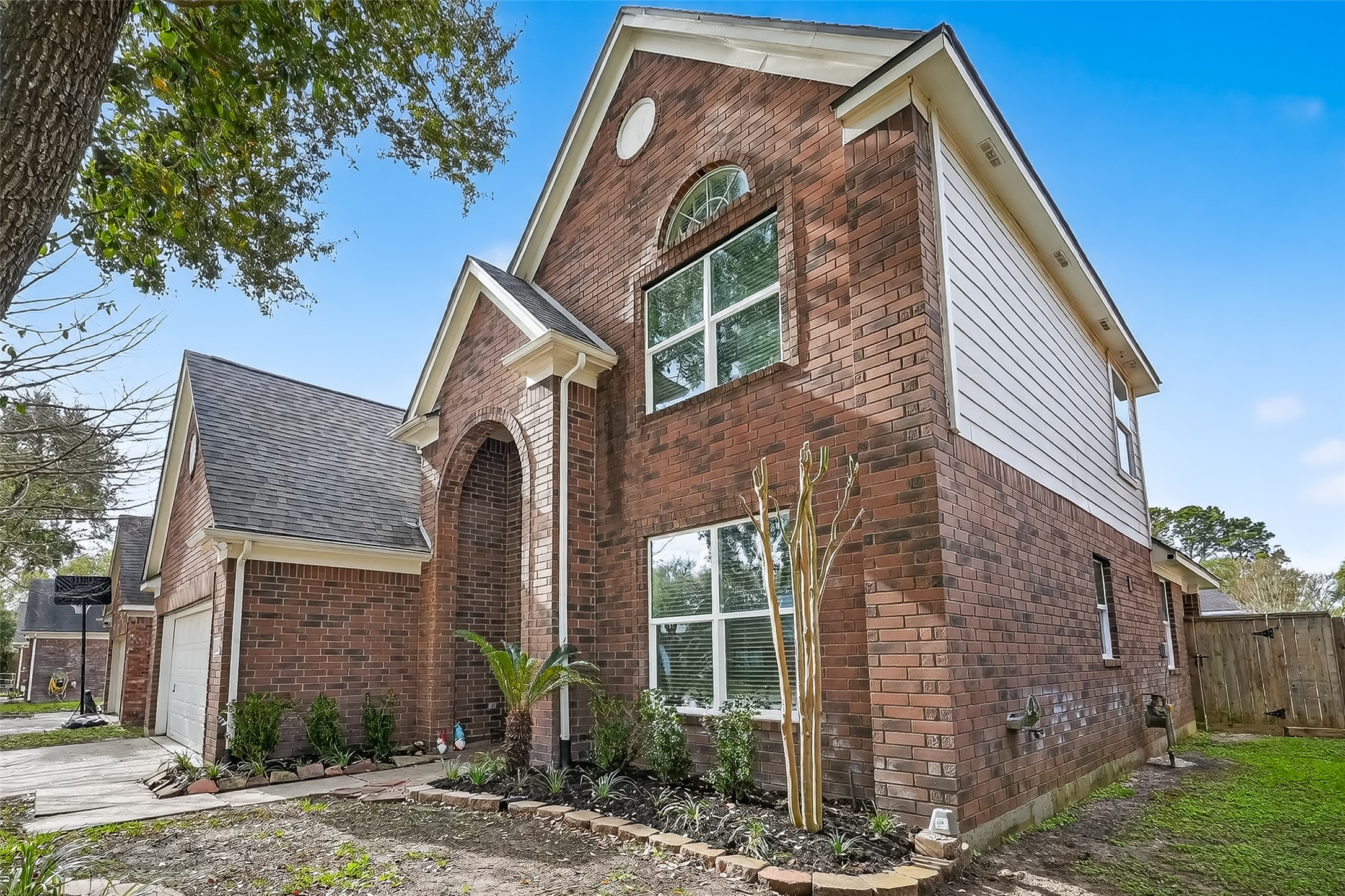 19715 Azalea Brook Way Houston, TX 77084 - Photo 2 of 48 a front view of a house with garden
