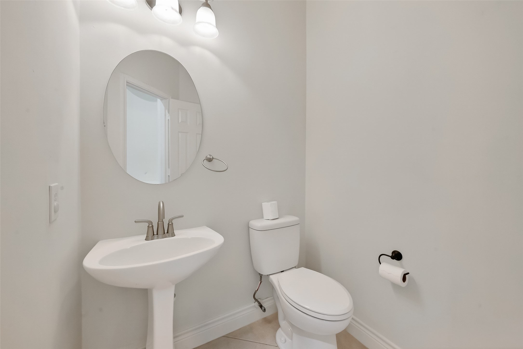 19715 Azalea Brook Way Houston, TX 77084 - Photo 25 of 48 a bathroom with a toilet sink and mirror