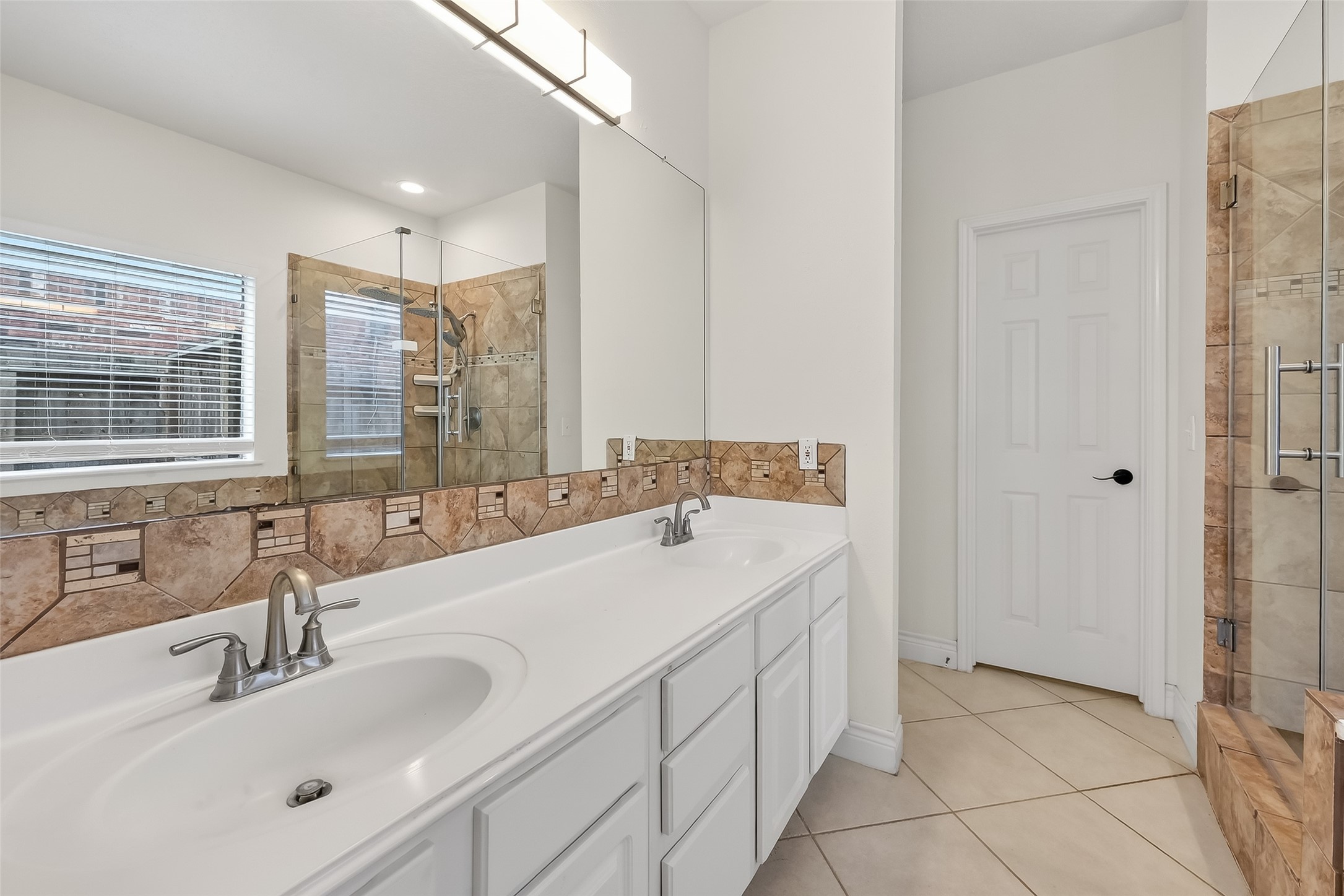 19715 Azalea Brook Way Houston, TX 77084 - Photo 29 of 48 a bathroom with a double vanity sink mirror and double
