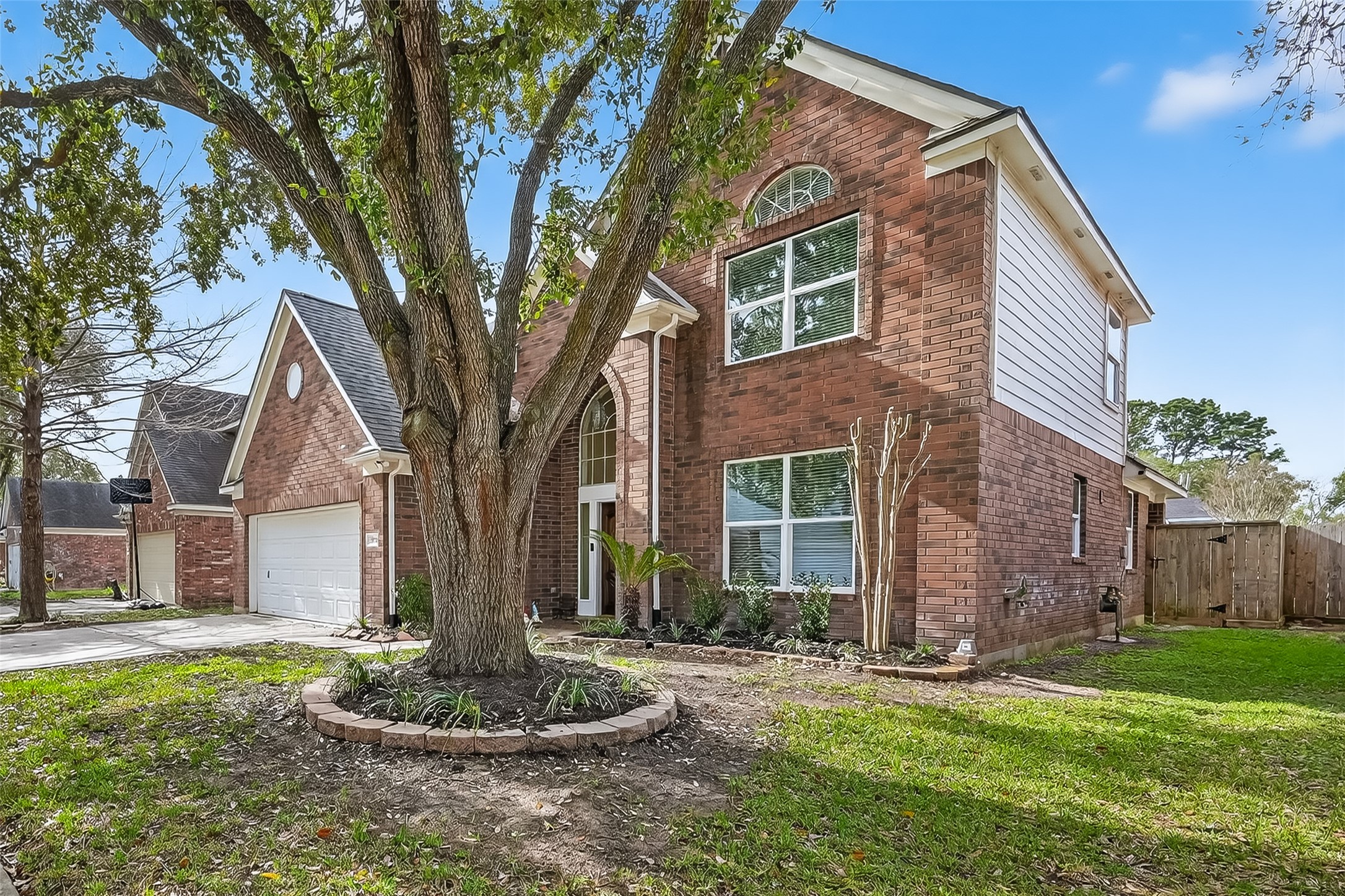 19715 Azalea Brook Way Houston, TX 77084 - Photo 3 of 48 a front view of a house with a garden