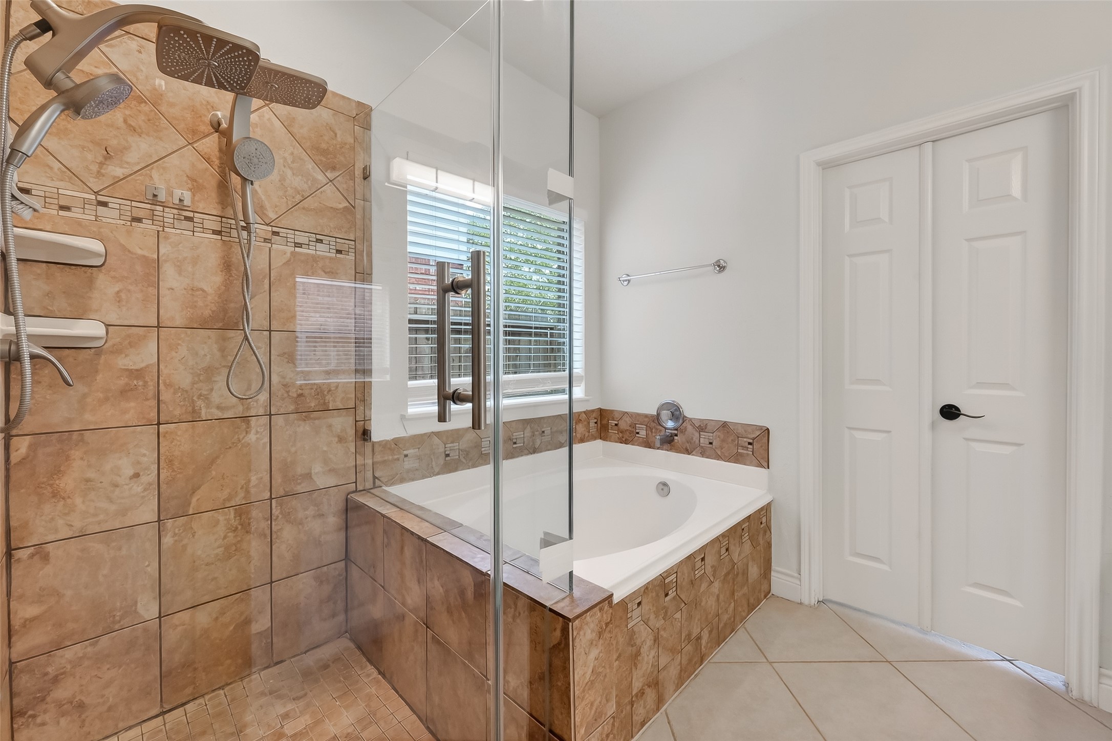 19715 Azalea Brook Way Houston, TX 77084 - Photo 31 of 48 a bathroom with a bathtub and shower