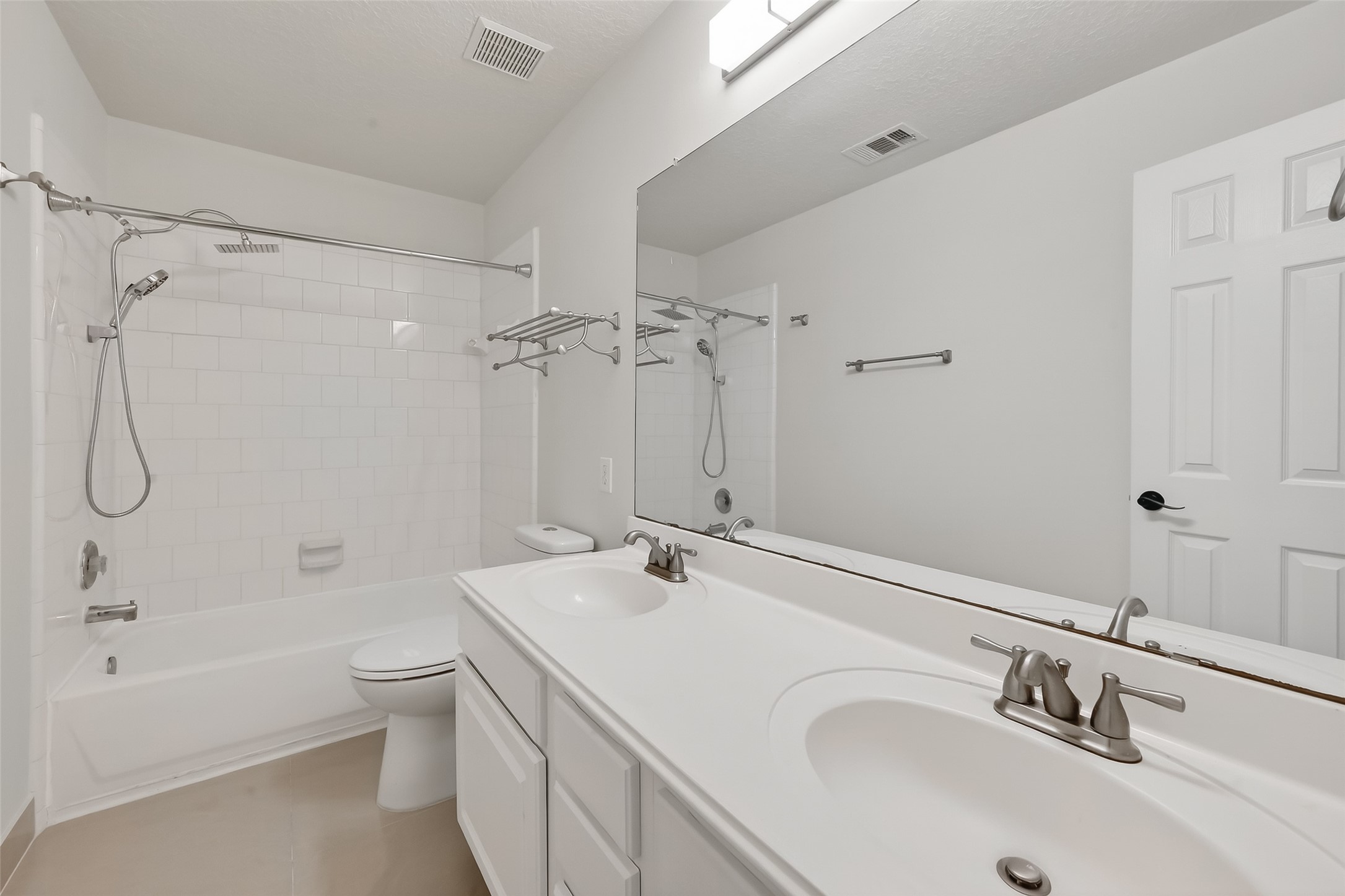 19715 Azalea Brook Way Houston, TX 77084 - Photo 37 of 48 a bathroom with a granite countertop sink a toilet and shower