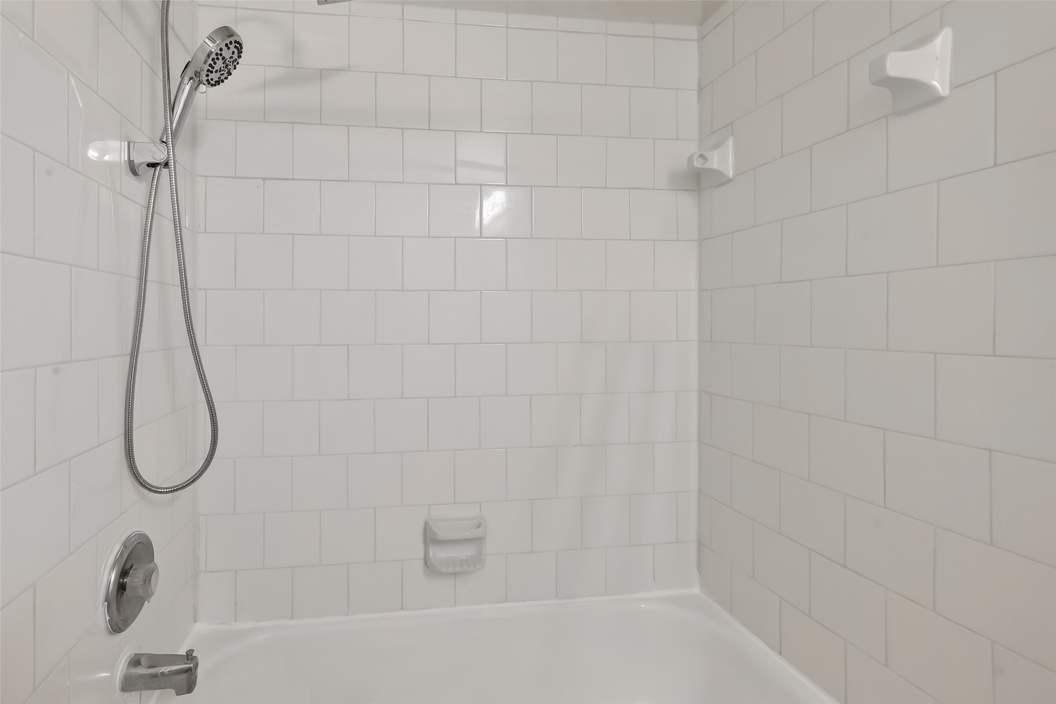 19715 Azalea Brook Way Houston, TX 77084 - Photo 38 of 48 a bathroom with a bath tub with a shower