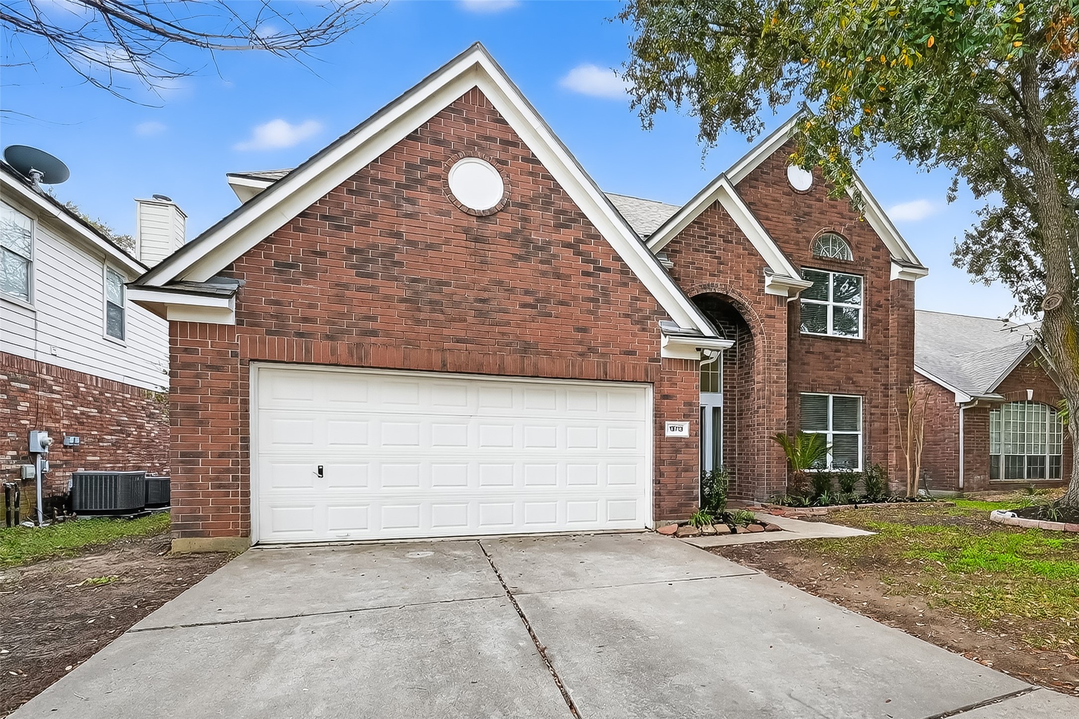 19715 Azalea Brook Way Houston, TX 77084 - Photo 4 of 48 a front view of a house with garden