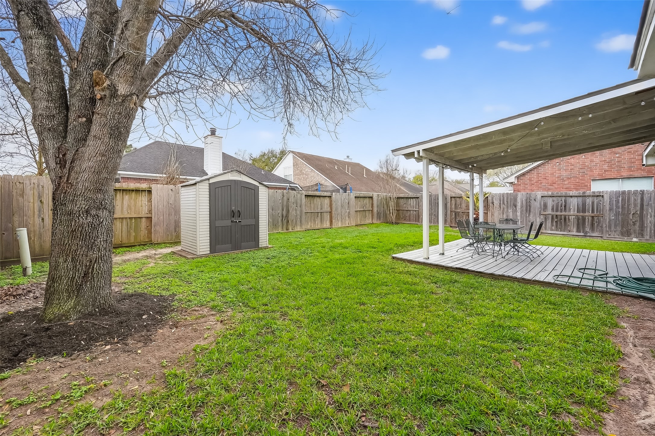 19715 Azalea Brook Way Houston, TX 77084 - Photo 46 of 48 a view of a house with backyard and a tree