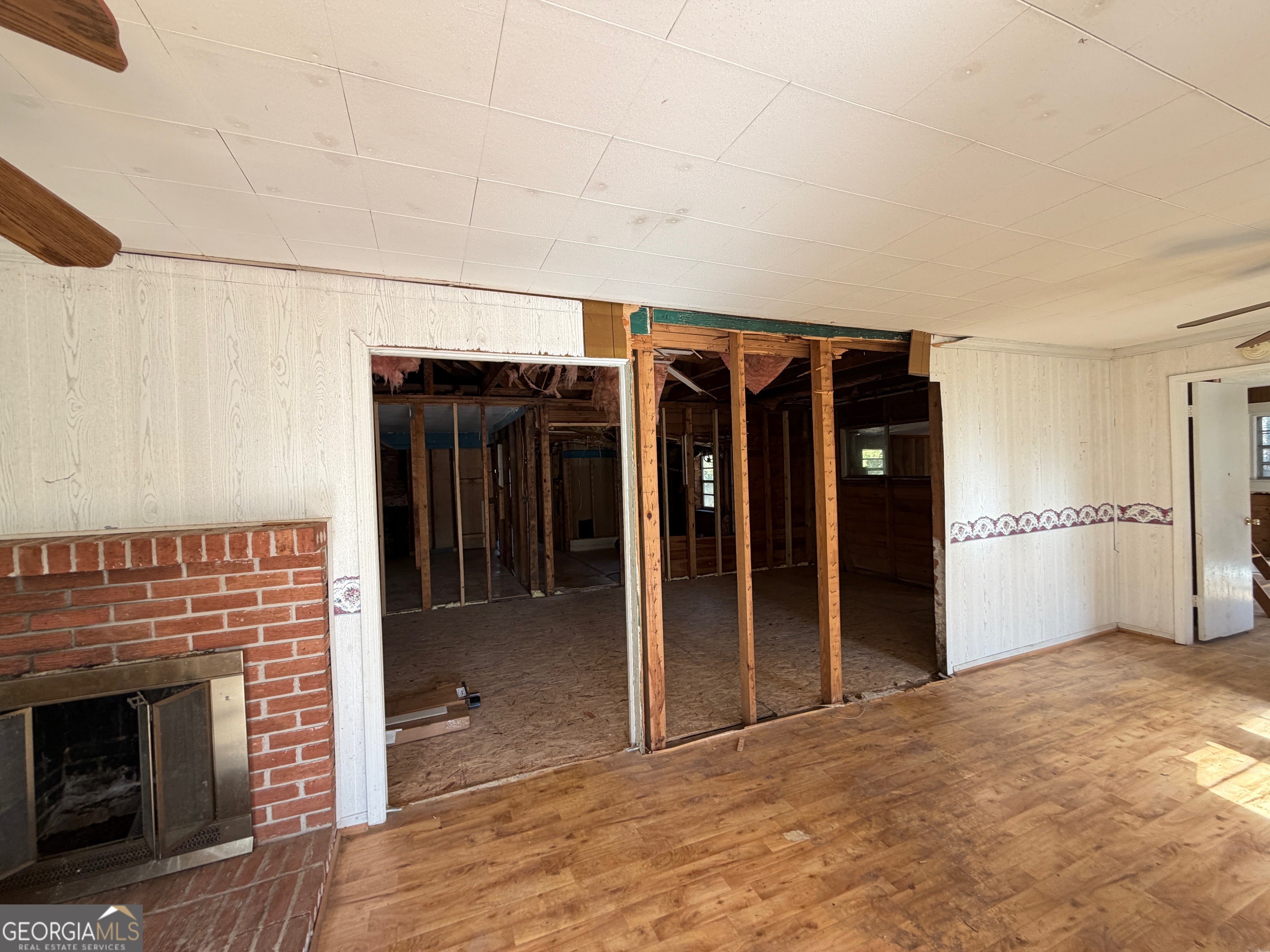 124 Bradshaw Road Thomaston, GA 30286 - Photo 6 of 10 a view of an empty room with cabinet and a fireplace
