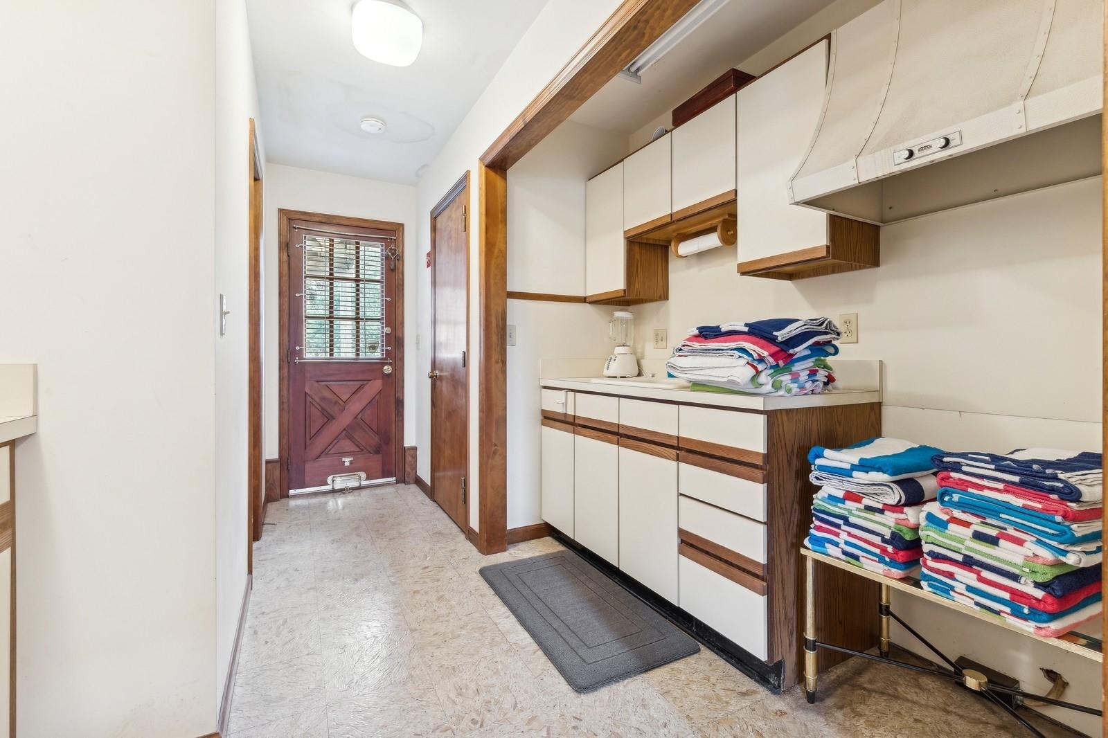 440 Pine Neck Road Southold, NY 11971 - Photo 17 of 21 a room with storage and utility