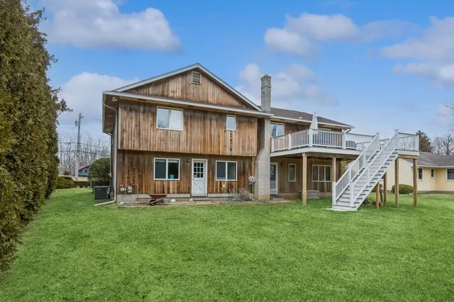 a view of a wooden fence and backyard
