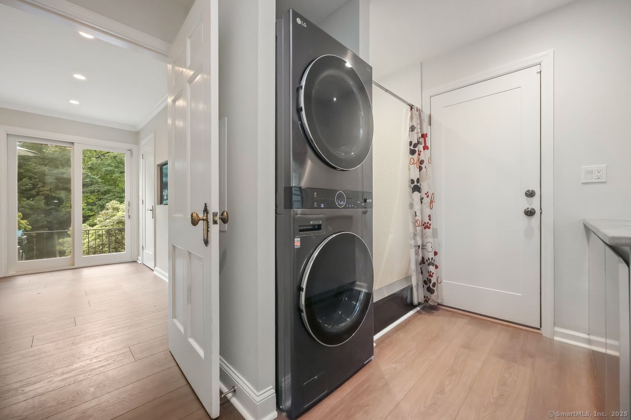 176 Logan Road New Canaan, CT 06840 - Photo 17 of 40 a view of a storage & utility room with a sink washer and dryer