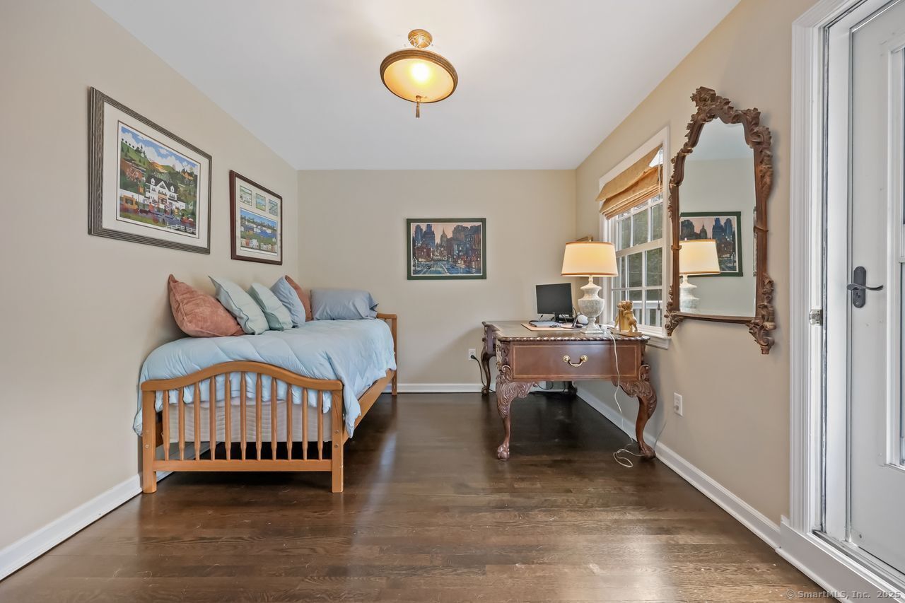 176 Logan Road New Canaan, CT 06840 - Photo 20 of 40 a bedroom with a bed and a window