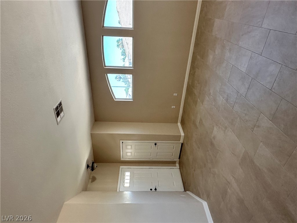 1922 Thunder Ridge Circle Henderson, NV 89012 - Photo 7 of 27 Natural light streams into this welcoming entry through thoughtfully placed windows.