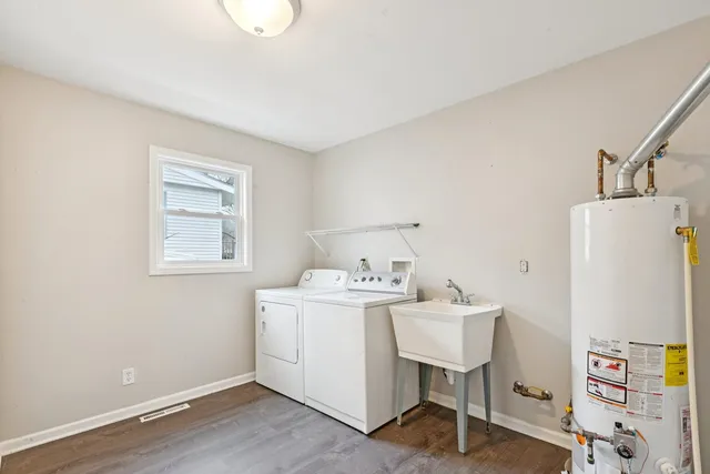 a view of a workspace with furniture and wooden floor
