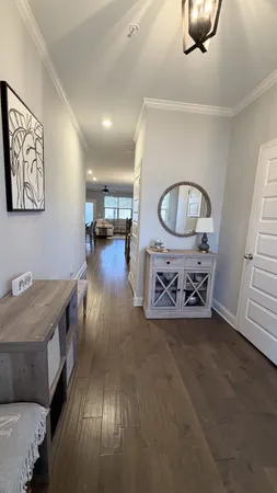 a living room with furniture and kitchen view
