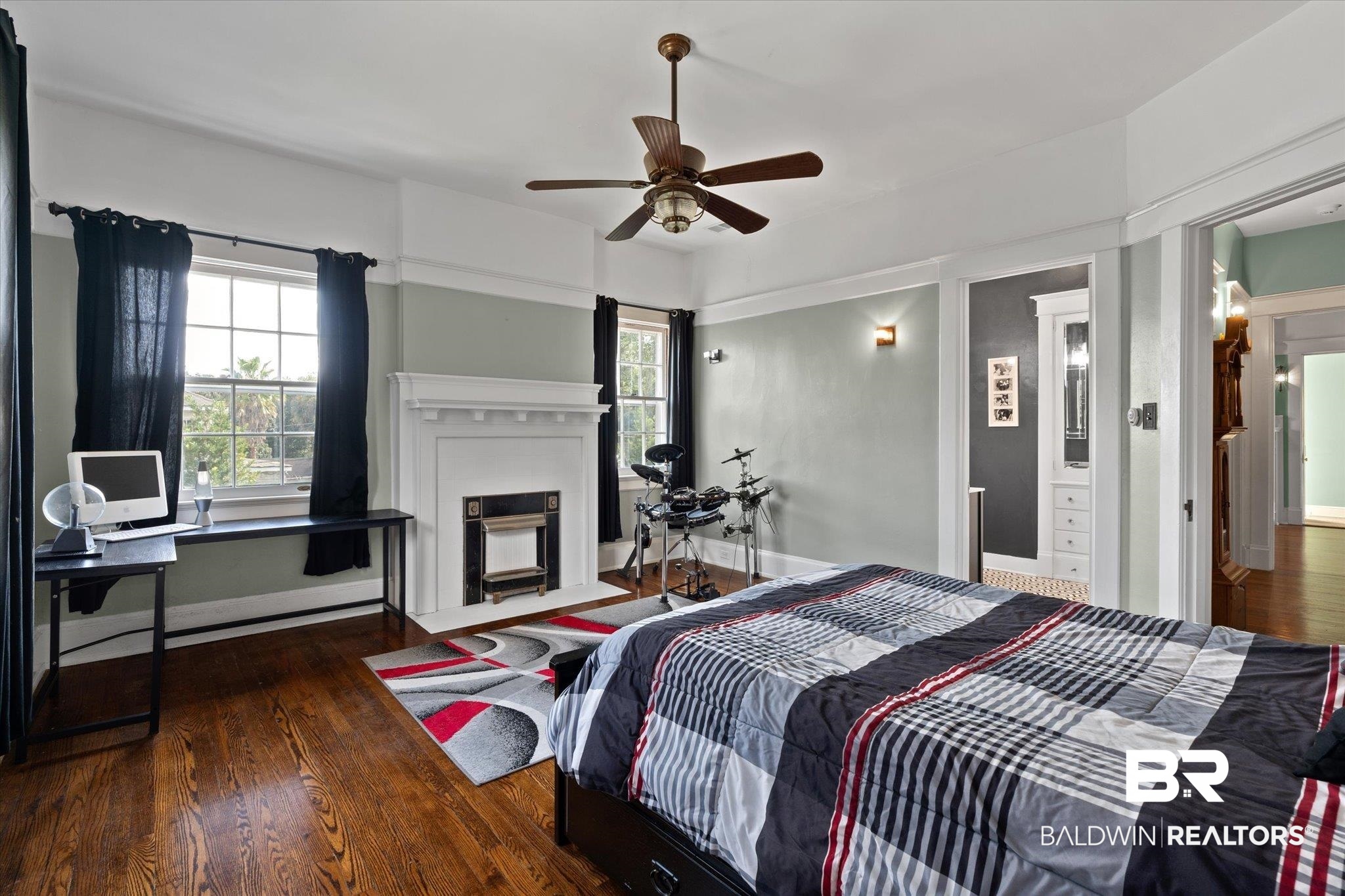 1953 Dauphin Street Mobile, AL 36606 - Photo 23 of 56 Bedroom with dark hardwood / wood-style flooring, multiple windows, and ceiling fan