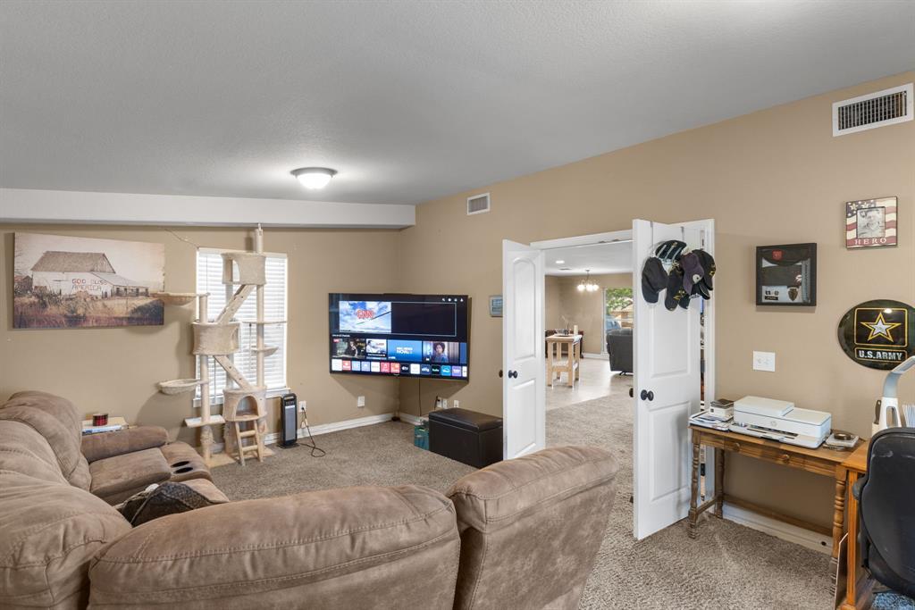 4504 Jennings Avenue Wichita Falls, TX 76310 - Photo 13 of 26 a living room with furniture and a flat screen tv